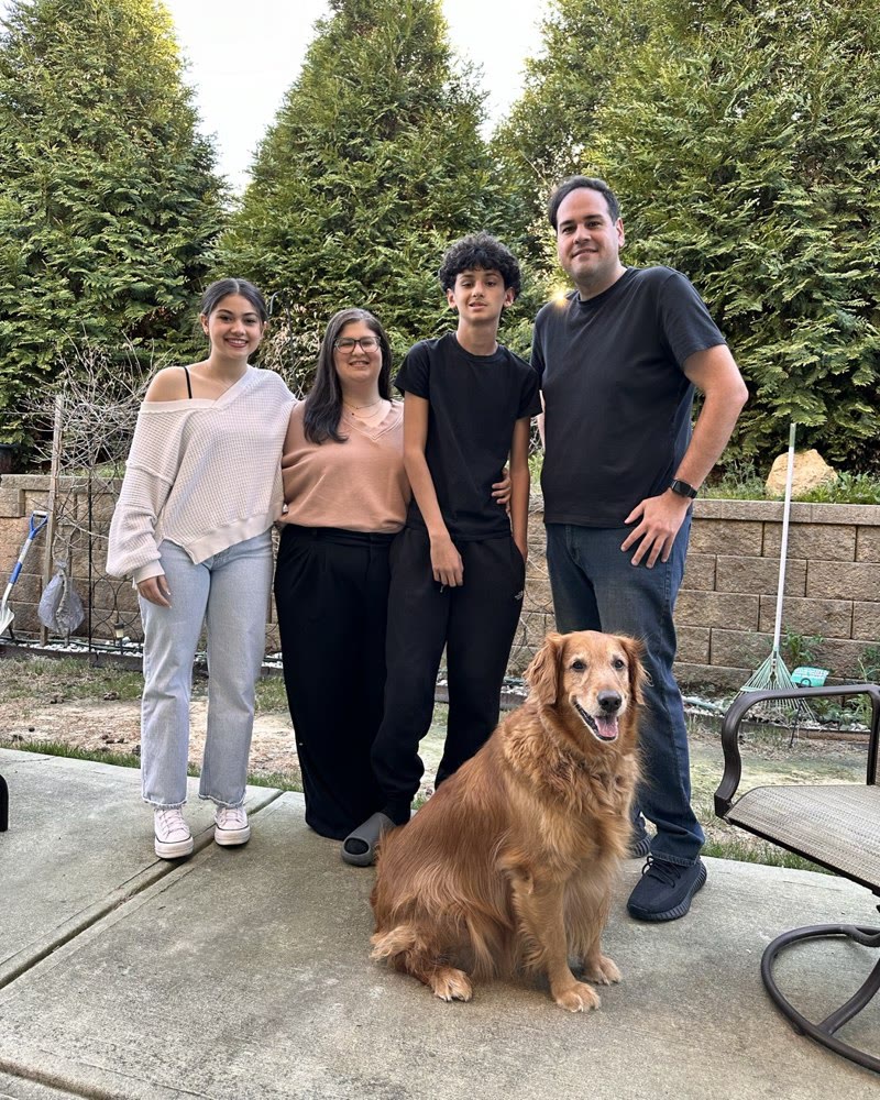 Marcio, Renata, their kids and their dog, at home, March 2024