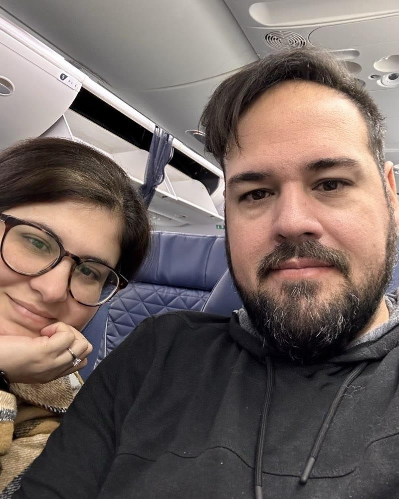 Marcio and Renata, On a plane, January 2023