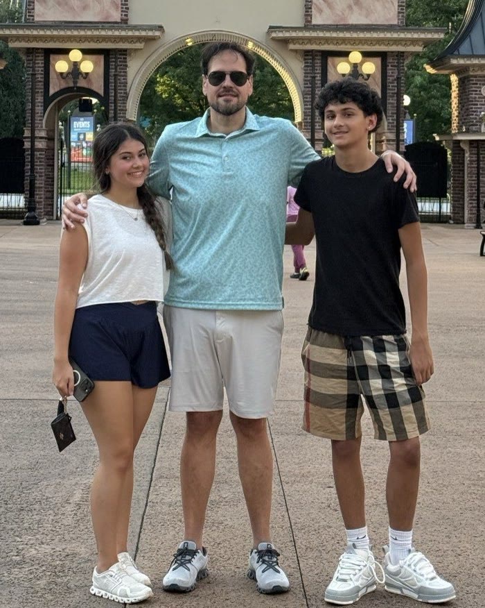 Marcio with their two kids at Six Flags, Father’s Day, June 2025